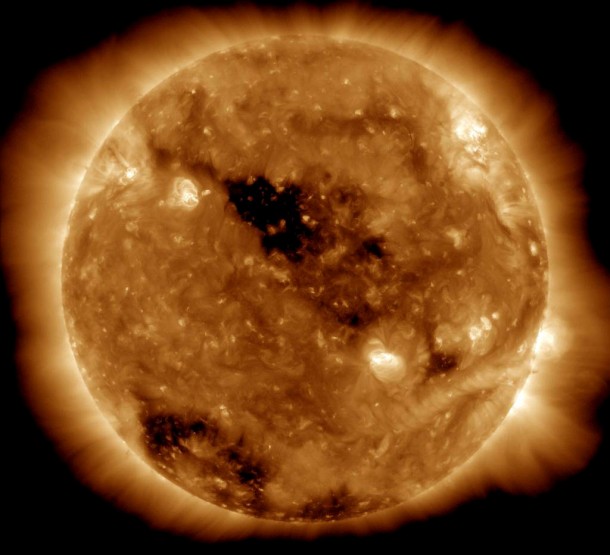 This Solar Dynamics Observatory image of the Sun taken on Jan. 10, 2011, in extreme ultraviolet light captures a dark coronal hole just about at Sun center. Credit: NASA/SDO/AIA This Solar Dynamics Observatory image of the Sun taken on Jan. 10, 2011, in extreme ultraviolet light captures a dark coronal hole just about at Sun center. Credit: NASA/SDO/AIA