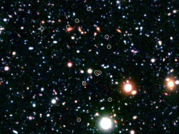 Astronomers have discovered a massive cluster of young galaxies forming in the distant universe. Image credit: Subaru/NASA/JPL-Caltech Astronomers have discovered a massive cluster of young galaxies forming in the distant universe. Image credit: Subaru/NASA/JPL-Caltech