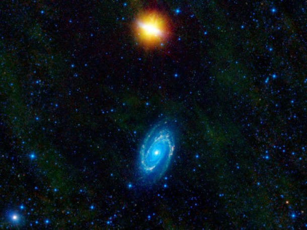 This image from NASA's Wide-Field Infrared Survey Explorer, or WISE, features two stunning galaxies engaged in an intergalactic dance. The galaxies, Messier 81 and Messier 82, swept by each other a few hundred million years ago, and will likely continue to twirl around each other multiple times before eventually merging into a single galaxy. Image credit: NASA/JPL-Caltech/UCLA This image from NASA's Wide-Field Infrared Survey Explorer, or WISE, features two stunning galaxies engaged in an intergalactic dance. The galaxies, Messier 81 and Messier 82, swept by each other a few hundred million years ago, and will likely continue to twirl around each other multiple times before eventually merging into a single galaxy. Image credit: NASA/JPL-Caltech/UCLA