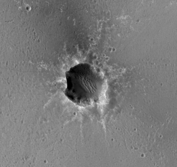 The High Resolution Imaging Science Experiment (HiRISE) camera on NASA's Mars Reconnaissance Orbiter acquired this image of the Opportunity rover on the southwest rim of "Santa Maria" crater on New Year's Eve 2010, or Martian day (sol) 2466 of the rover's work on Mars. Image credit: NASA/JPL-Caltech/Univ. of Arizona The High Resolution Imaging Science Experiment (HiRISE) camera on NASA's Mars Reconnaissance Orbiter acquired this image of the Opportunity rover on the southwest rim of "Santa Maria" crater on New Year's Eve 2010, or Martian day (sol) 2466 of the rover's work on Mars. Image credit: NASA/JPL-Caltech/Univ. of Arizona