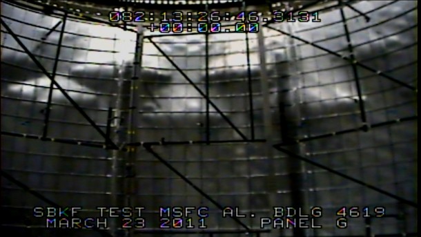 View from a test camera inside the cylinder from the March 23 Shell Buckling Knockdown Factor test at NASA's Marshall Space Flight Center. The shadowed areas are buckled regions of the aluminum-lithium test article. (NASA/MSFC) View from a test camera inside the cylinder from the March 23 Shell Buckling Knockdown Factor test at NASA's Marshall Space Flight Center. The shadowed areas are buckled regions of the aluminum-lithium test article. (NASA/MSFC)