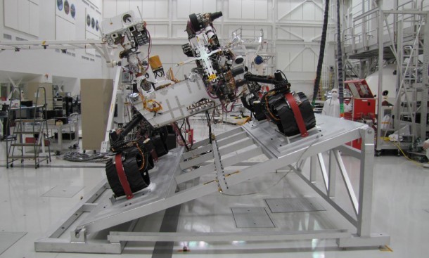 The image shows Curiosity on a tilt table in the Spacecraft Assembly Facility at NASA's Jet Propulsion Laboratory, Pasadena, California. Image Credit: NASA/JPL-Caltech The image shows Curiosity on a tilt table in the Spacecraft Assembly Facility at NASA's Jet Propulsion Laboratory, Pasadena, California. Image Credit: NASA/JPL-Caltech
