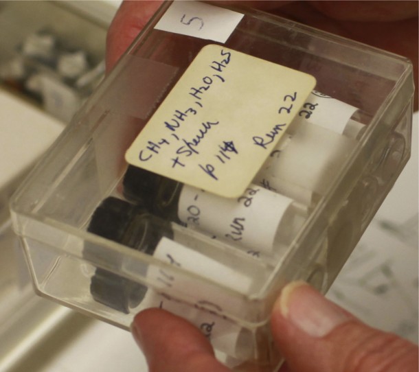 The original box containing archived spark discharge samples prepared by Stanley Miller in 1958. For unknown reasons, Miller never analyzed these even though this is his first experiment using hydrogen sulfide. The label shows Miller’s original writing: p 114 refers to his notebook. Image credit: Jeffrey Bada and Robert Benson/Scripps Institution of Oceanography, University of California at San Diego. The original box containing archived spark discharge samples prepared by Stanley Miller in 1958. For unknown reasons, Miller never analyzed these even though this is his first experiment using hydrogen sulfide. The label shows Miller’s original writing: p 114 refers to his notebook. Image credit: Jeffrey Bada and Robert Benson/Scripps Institution of Oceanography, University of California at San Diego.