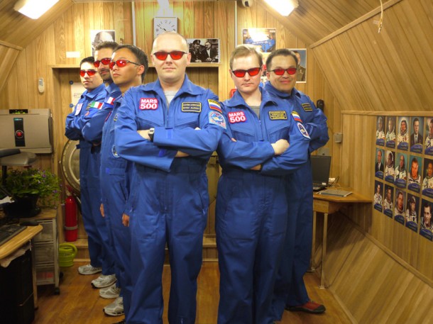Mars500 crew having a fun portrait with red protective goggles.   Credits: ESA
