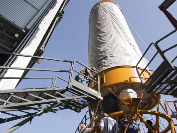 Workers guide Juno's Centaur upper stage onto the mission's waiting Atlas V rocket. Image credit: NASA/KSC Workers guide Juno's Centaur upper stage onto the mission's waiting Atlas V rocket. Image credit: NASA/KSC