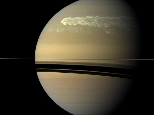 The huge storm churning through the atmosphere in Saturn's northern hemisphere overtakes itself as it encircles the planet in this true-color view from NASAs Cassini spacecraft. Image credit: NASA/JPL-Caltech/SSI The huge storm churning through the atmosphere in Saturn's northern hemisphere overtakes itself as it encircles the planet in this true-color view from NASAs Cassini spacecraft. Image credit: NASA/JPL-Caltech/SSI