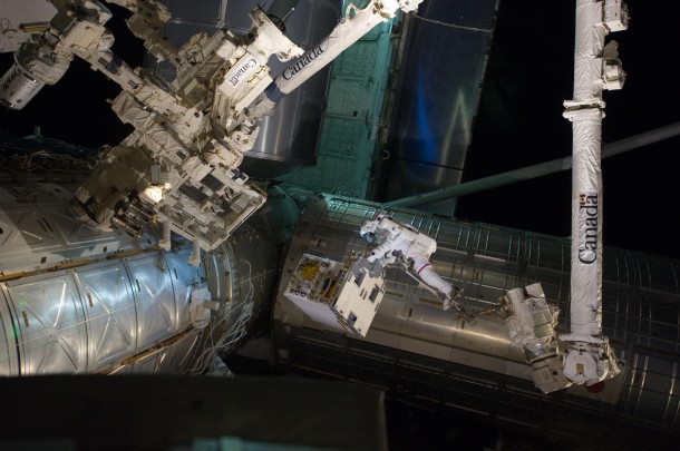Spacewalker Mike Fossum carries the Robotic Refueling Mission module from shuttle Atlantis to its temporary platform on the International Space Station on July 12, 2011. A robotic maneuver in September 2011 will transfer RRM to its permanent location on station’s ExPRESS Logistics Carrier-4. Credit: NASA Spacewalker Mike Fossum carries the Robotic Refueling Mission module from shuttle Atlantis to its temporary platform on the International Space Station on July 12, 2011. A robotic maneuver in September 2011 will transfer RRM to its permanent location on station’s ExPRESS Logistics Carrier-4. Credit: NASA