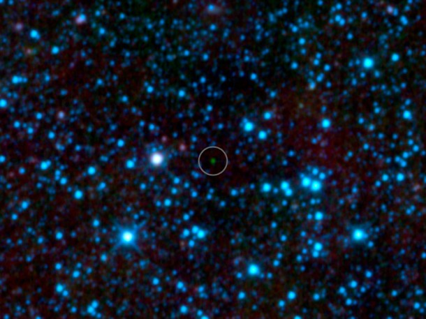 NASA's Wide-field Infrared Survey Explorer, or WISE, has uncovered the coldest brown dwarf known so far (green dot in very center of this infrared image). Image credit: NASA/JPL-Caltech/UCLA NASA's Wide-field Infrared Survey Explorer, or WISE, has uncovered the coldest brown dwarf known so far (green dot in very center of this infrared image). Image credit: NASA/JPL-Caltech/UCLA