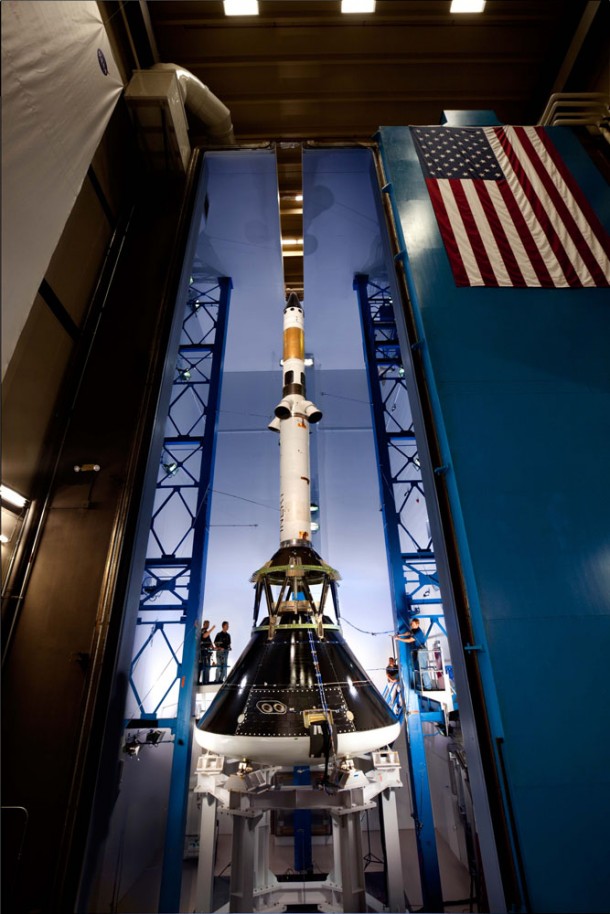 Technicians position microphones around the Orion MPCV and launch abort system test articles in preparation for the second round of testing in the acoustic chamber at Lockheed Martin’s facilities near Denver. The vehicle was bombarded by acoustic levels of 150 decibels to simulate conditions during launch and abort if necessary. Photo credit: Lockheed Martin Technicians position microphones around the Orion MPCV and launch abort system test articles in preparation for the second round of testing in the acoustic chamber at Lockheed Martin’s facilities near Denver. The vehicle was bombarded by acoustic levels of 150 decibels to simulate conditions during launch and abort if necessary. Photo credit: Lockheed Martin