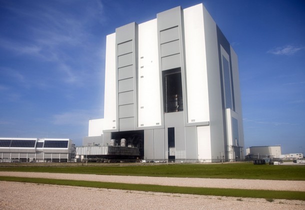 Vehicle Assembly Building at NASA's Kennedy Space Center in Florida would again be called on to stack a rocket for astronauts. The landmark is one of many facilities and machines at Kennedy built to handle massive launchers. Another is the crawler-transporter, seen in this emerging from the VAB. Photo credit: NASA/Frankie Martin Vehicle Assembly Building at NASA's Kennedy Space Center in Florida would again be called on to stack a rocket for astronauts. The landmark is one of many facilities and machines at Kennedy built to handle massive launchers. Another is the crawler-transporter, seen in this emerging from the VAB. Photo credit: NASA/Frankie Martin