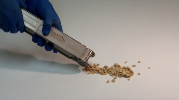 This is a demonstration of the sample collection chamber. Credit: NASA/Rob Andreoli 