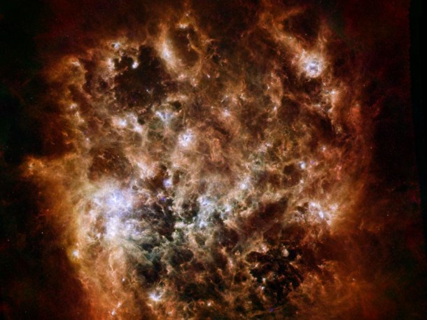 This new image shows the Large Magellanic Cloud galaxy in infrared light as seen by the Herschel Space Observatory, a European Space Agency-led mission with important NASA contributions, and NASA's Spitzer Space Telescope. Image credit: ESA/NASA/JPL-Caltech/STScI This new image shows the Large Magellanic Cloud galaxy in infrared light as seen by the Herschel Space Observatory, a European Space Agency-led mission with important NASA contributions, and NASA's Spitzer Space Telescope. Image credit: ESA/NASA/JPL-Caltech/STScI