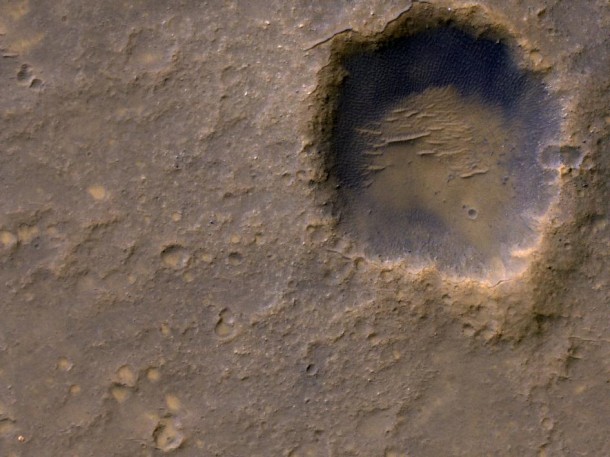 Near the lower left corner of this view is the three-petal lander platform that NASA's Mars Exploration Rover Spirit drove off in January 2004. Image credit: NASA/JPL-Caltech/Univ. of Arizona Near the lower left corner of this view is the three-petal lander platform that NASA's Mars Exploration Rover Spirit drove off in January 2004. Image credit: NASA/JPL-Caltech/Univ. of Arizona
