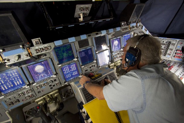A technician monitors data displayed on space shuttle Atlantis' glass cockpit during power-down preparations. Photo credit: NASA/Jim Grossmann A technician monitors data displayed on space shuttle Atlantis' glass cockpit during power-down preparations. Photo credit: NASA/Jim Grossmann