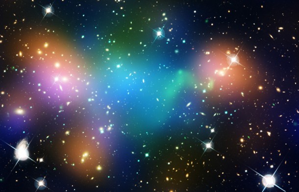 This composite image shows the distribution of dark matter, galaxies, and hot gas in the core of the merging galaxy cluster Abell 520, formed from a violent collision of massive galaxy clusters. The natural-color image of the galaxies was taken with NASA's Hubble Space Telescope and with the Canada-France-Hawaii Telescope in Hawaii. Superimposed on the image are "false-colored" maps showing the concentration of starlight, hot gas, and dark matter in the cluster. Starlight from galaxies, derived from observations by the Canada-France-Hawaii Telescope, is colored orange. The green-tinted regions show hot gas, as detected by NASA's Chandra X-ray Observatory. The gas is evidence that a collision took place. The blue-colored areas pinpoint the location of most of the mass in the cluster, which is dominated by dark matter. Dark matter is an invisible substance that makes up most of the universe's mass. The dark-matter map was derived from the Hubble Wide Field Planetary Camera 2 observations, by detecting how light from distant objects is distorted by the cluster galaxies, an effect called gravitational lensing. The blend of blue and green in the center of the image reveals that a clump of dark matter resides near most of the hot gas, where very few galaxies are found. This finding confirms previous observations of a dark-matter core in the cluster. The result could present a challenge to basic theories of dark matter, which predict that galaxies should be anchored to dark matter, even during the shock of a collision. Abell 520 resides 2.4 billion light-years away. Credit: NASA, ESA, CFHT, CXO, M.J. Jee (University of California, Davis), and A. Mahdavi (San Francisco State University) This composite image shows the distribution of dark matter, galaxies, and hot gas in the core of the merging galaxy cluster Abell 520, formed from a violent collision of massive galaxy clusters. The natural-color image of the galaxies was taken with NASA's Hubble Space Telescope and with the Canada-France-Hawaii Telescope in Hawaii. Superimposed on the image are "false-colored" maps showing the concentration of starlight, hot gas, and dark matter in the cluster. Starlight from galaxies, derived from observations by the Canada-France-Hawaii Telescope, is colored orange. The green-tinted regions show hot gas, as detected by NASA's Chandra X-ray Observatory. The gas is evidence that a collision took place. The blue-colored areas pinpoint the location of most of the mass in the cluster, which is dominated by dark matter. Dark matter is an invisible substance that makes up most of the universe's mass. The dark-matter map was derived from the Hubble Wide Field Planetary Camera 2 observations, by detecting how light from distant objects is distorted by the cluster galaxies, an effect called gravitational lensing. The blend of blue and green in the center of the image reveals that a clump of dark matter resides near most of the hot gas, where very few galaxies are found. This finding confirms previous observations of a dark-matter core in the cluster. The result could present a challenge to basic theories of dark matter, which predict that galaxies should be anchored to dark matter, even during the shock of a collision. Abell 520 resides 2.4 billion light-years away. Credit: NASA, ESA, CFHT, CXO, M.J. Jee (University of California, Davis), and A. Mahdavi (San Francisco State University)