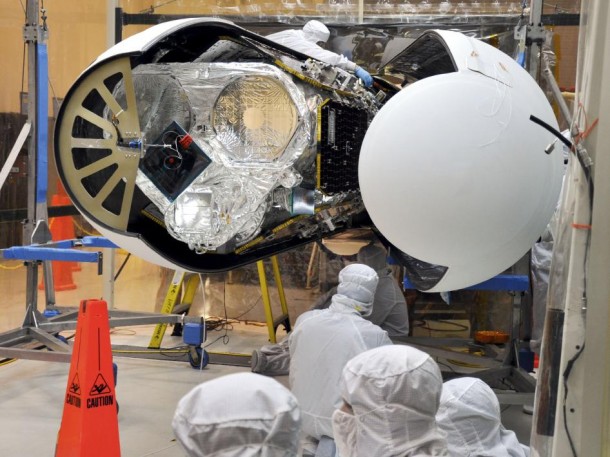 An Orbital Sciences technician completes final checks of NASA's Nuclear Spectroscopic Telescope Array, or NuSTAR, inside the Orbital Sciences processing facility at Vandenberg Air Force Base in California before the Pegasus payload fairing is secured around it. Image credit: NASA An Orbital Sciences technician completes final checks of NASA's Nuclear Spectroscopic Telescope Array, or NuSTAR, inside the Orbital Sciences processing facility at Vandenberg Air Force Base in California before the Pegasus payload fairing is secured around it. Image credit: NASA
