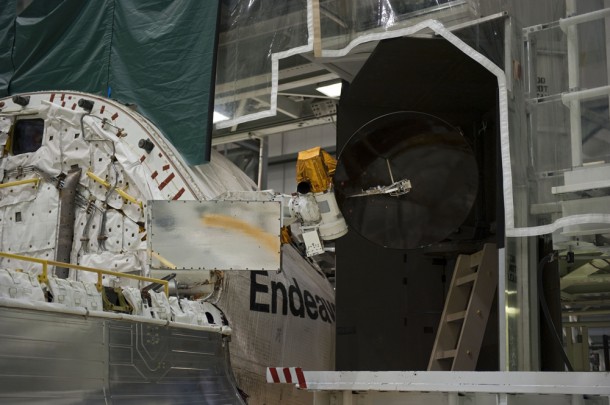 One of space shuttle Endeavour's payload bay doors has been fully opened and an antenna retracted on Feb. 3 in Orbiter Processing Facility-2 at Kennedy Space Center. Photo credit: NASA/Kim Shiflett One of space shuttle Endeavour's payload bay doors has been fully opened and an antenna retracted on Feb. 3 in Orbiter Processing Facility-2 at Kennedy Space Center. Photo credit: NASA/Kim Shiflett