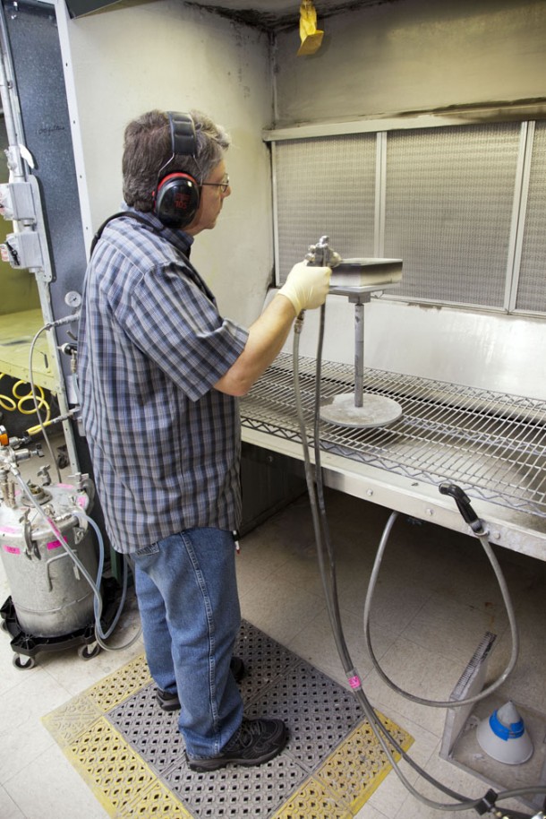 Frank Pelkey, a United Space Alliance technician at NASA's Kennedy Space Center in Florida, works with a heat shield tile that will be installed to the backshell of the Orion Multi-Purpose Crew Vehicle's Exploration Flight Test (EFT-1) capsule. Photo credit: NASA/Frankie Martin Frank Pelkey, a United Space Alliance technician at NASA's Kennedy Space Center in Florida, works with a heat shield tile that will be installed to the backshell of the Orion Multi-Purpose Crew Vehicle's Exploration Flight Test (EFT-1) capsule. Photo credit: NASA/Frankie Martin
