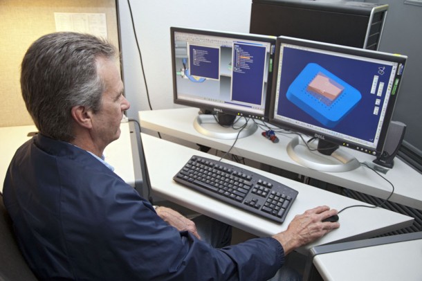 John Livingston, a United Space Alliance engineer at NASA's Kennedy Space Center in Florida, shows the digital image of a heat shield tile that will be used on an Orion spacecraft. Photo credit: NASA/Frankie Martin John Livingston, a United Space Alliance engineer at NASA's Kennedy Space Center in Florida, shows the digital image of a heat shield tile that will be used on an Orion spacecraft. Photo credit: NASA/Frankie Martin