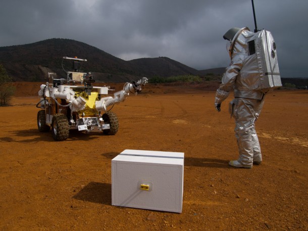 Eurobot giving a hand to astronaut Eurobot giving a hand to astronaut