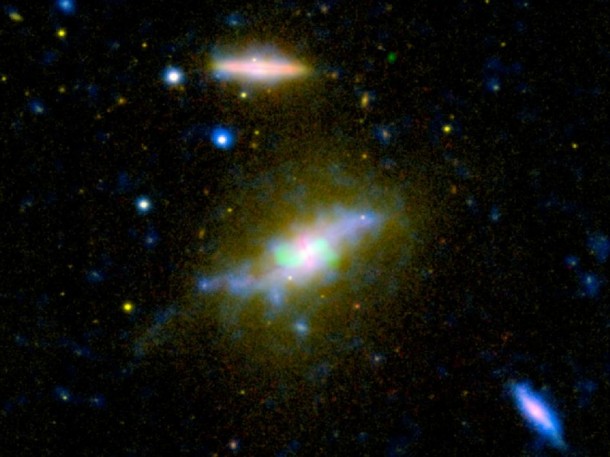 Time is running out for the galaxy NGC 3801, seen in this composite image combining light from across the spectrum, ranging from ultraviolet to radio. NASA's Galaxy Evolution Explorer and other instruments have helped catch the galaxy NGC 3801 in the act of destroying its cold, gaseous fuel for new stars. Astronomers believe this marks the beginning of its transition from a vigorous spiral galaxy to a quiescent elliptical galaxy whose star-forming days are long past. Image credit: NASA/JPL-Caltech/SDSS/NRAO/ASIAA Time is running out for the galaxy NGC 3801, seen in this composite image combining light from across the spectrum, ranging from ultraviolet to radio. NASA's Galaxy Evolution Explorer and other instruments have helped catch the galaxy NGC 3801 in the act of destroying its cold, gaseous fuel for new stars. Astronomers believe this marks the beginning of its transition from a vigorous spiral galaxy to a quiescent elliptical galaxy whose star-forming days are long past. Image credit: NASA/JPL-Caltech/SDSS/NRAO/ASIAA