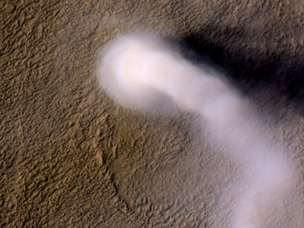 A Martian dust devil roughly 12 miles (20 kilometers) high was captured winding its way along the Amazonis Planitia region of Northern Mars on March 14, 2012 by the High Resolution Imaging Science Experiment (HiRISE) camera on NASA's Mars Reconnaissance Orbiter. Despite its height, the plume is little more than three-quarters of a football field wide (70 yards, or 70 meters). Image credit: NASA/JPL-Caltech/UA A Martian dust devil roughly 12 miles (20 kilometers) high was captured winding its way along the Amazonis Planitia region of Northern Mars on March 14, 2012 by the High Resolution Imaging Science Experiment (HiRISE) camera on NASA's Mars Reconnaissance Orbiter. Despite its height, the plume is little more than three-quarters of a football field wide (70 yards, or 70 meters). Image credit: NASA/JPL-Caltech/UA