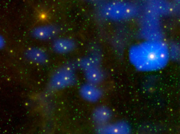 It's a dust bunny of cosmic proportions. Astronomers used images from NASA's Wide-field Infrared Survey Explorer, or WISE, to locate an aging star shedding loads of dust (orange dot at upper left). Only one other star, called Sakurai's object, has been caught erupting with such large amounts of dust. The process is a natural part of aging for stars like our sun. As they puff up into red giants, they shed dust that is later recycled back into other stars, planets, and in the case of our solar system, living creatures. Image credit: NASA/JPL-Caltech It's a dust bunny of cosmic proportions. Astronomers used images from NASA's Wide-field Infrared Survey Explorer, or WISE, to locate an aging star shedding loads of dust (orange dot at upper left). Only one other star, called Sakurai's object, has been caught erupting with such large amounts of dust. The process is a natural part of aging for stars like our sun. As they puff up into red giants, they shed dust that is later recycled back into other stars, planets, and in the case of our solar system, living creatures. Image credit: NASA/JPL-Caltech