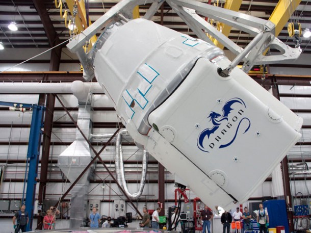 The Dragon spacecraft being rotated before it is mated to the Falcon 9 rocket in SpaceX’s hangar in Cape Canaveral, FL. Credit: NASA The Dragon spacecraft being rotated before it is mated to the Falcon 9 rocket in SpaceX’s hangar in Cape Canaveral, FL. Credit: NASA