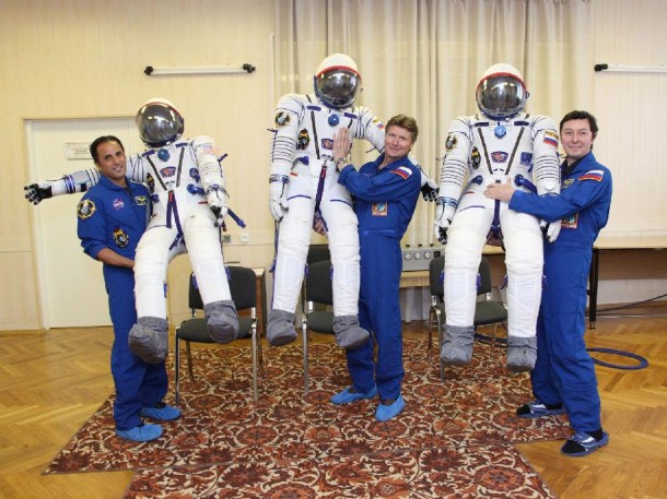 Holding their launch and entry suits while waiting to join Expedition 31 are (from left) Flight Engineers Joe Acaba, Gennady Padalka and Sergei Revin. Credit: NASA/Victor Zelentsov Holding their launch and entry suits while waiting to join Expedition 31 are (from left) Flight Engineers Joe Acaba, Gennady Padalka and Sergei Revin. Credit: NASA/Victor Zelentsov