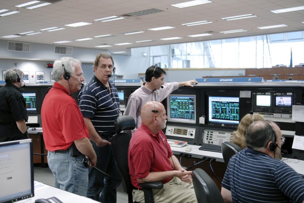Mike Ciannilli, leaning on console, looks over readouts from Endeavour as the spacecraft's electrical power was shut down for the last time. Photo credit: NASA/Tim Jacobs Mike Ciannilli, leaning on console, looks over readouts from Endeavour as the spacecraft's electrical power was shut down for the last time. Photo credit: NASA/Tim Jacobs