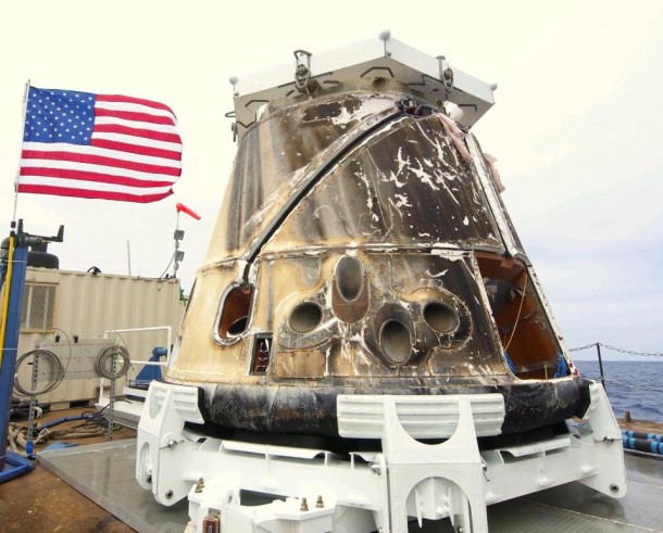 Dragon on the barge after being retrieved from the Pacific Ocean after splashdown. Credit: SpaceX