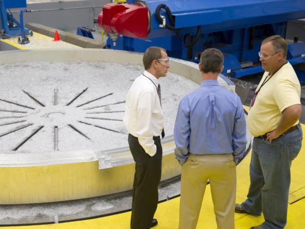 Members of the SLS team discuss the machining of an aluminum adapter ring at the Marshall Center. (NASA/MSFC) Members of the SLS team discuss the machining of an aluminum adapter ring at the Marshall Center. (NASA/MSFC)
