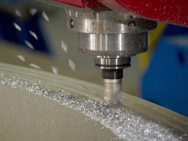 A specialized state-of-the-art milling tool grinds away at a 20' diameter aluminum ring. (NASA/MSFC) A specialized state-of-the-art milling tool grinds away at a 20' diameter aluminum ring. (NASA/MSFC)