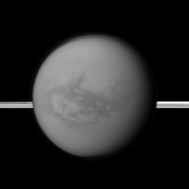 Saturn's rings lie in the distance as the Cassini spacecraft looks toward Titan and its dark region called Shangri-La, east of the landing site of the Huygens Probe. Image Credit: NASA/JPL-Caltech/Space Science Institute Saturn's rings lie in the distance as the Cassini spacecraft looks toward Titan and its dark region called Shangri-La, east of the landing site of the Huygens Probe. Image Credit: NASA/JPL-Caltech/Space Science Institute
