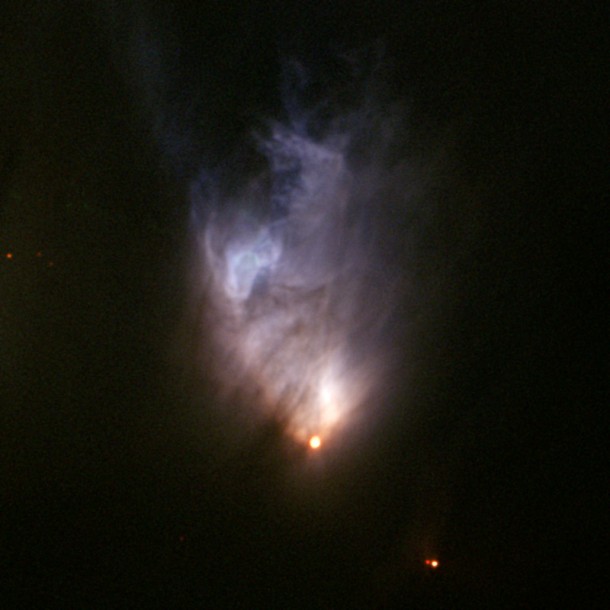 The protostar V1647 Orionis resides at the tip of a conical glow called McNeil's Nebula, which was discovered in January 2004 near the peak of an outburst. This image, from the Frederick C. Gillett Gemini Telescope in Hawaii, shows the nebula as it appeared on Feb. 14, 2004. (Credit: Gemini Observatory) The protostar V1647 Orionis resides at the tip of a conical glow called McNeil's Nebula, which was discovered in January 2004 near the peak of an outburst. This image, from the Frederick C. Gillett Gemini Telescope in Hawaii, shows the nebula as it appeared on Feb. 14, 2004. (Credit: Gemini Observatory)
