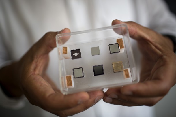 Mini ion thrusters are manufactured using micro-manufacturing techniques. This image shows an example of the different parts comprising a thruster. The finalized device is at the bottom right, measuring 1 cm by 1 cm and 2 mm in thickness. Photo: M. Scott Brauer Mini ion thrusters are manufactured using micro-manufacturing techniques. This image shows an example of the different parts comprising a thruster. The finalized device is at the bottom right, measuring 1 cm by 1 cm and 2 mm in thickness. Photo: M. Scott Brauer