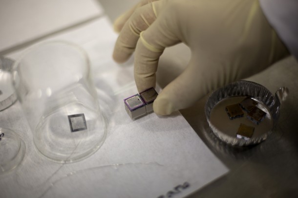 A pair of mini ion thrusters, including their propellant tanks, is prepared for tests. Photo: M. Scott Brauer A pair of mini ion thrusters, including their propellant tanks, is prepared for tests. Photo: M. Scott Brauer