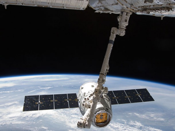 SpaceX's Dragon spacecraft moves in for attachment to the International Space Station during historic mission. (Photo Credit: NASA) SpaceX's Dragon spacecraft moves in for attachment to the International Space Station during historic mission. (Photo Credit: NASA)