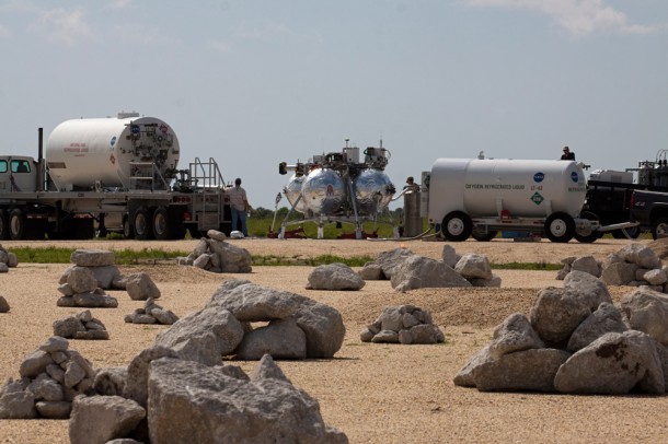 The Project Morpheus lander is moved into position beside its hazard field at Kennedy's Shuttle Landing Facility in preparation for its first free flight. Photo credit: NASA/Charisse Nahser The Project Morpheus lander is moved into position beside its hazard field at Kennedy's Shuttle Landing Facility in preparation for its first free flight. Photo credit: NASA/Charisse Nahser