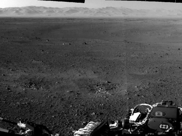 These are the first two full-resolution images of the Martian surface from the Navigation cameras on NASA's Curiosity rover, which are located on the rover's "head" or mast. The rim of Gale Crater can be seen in the distance beyond the pebbly ground. These are the first two full-resolution images of the Martian surface from the Navigation cameras on NASA's Curiosity rover, which are located on the rover's "head" or mast. The rim of Gale Crater can be seen in the distance beyond the pebbly ground.
