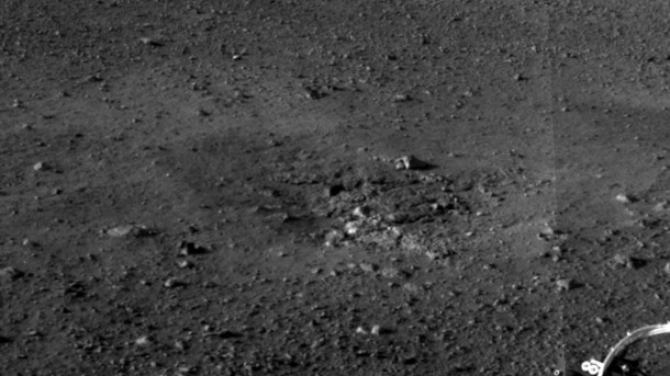 Rocket Thrusters Expose Bedrock This is a close-up view of a zone where the soil at Curiosity's landing site was blown away by the thrusters on the rover's descent stage. The excavation of the soil reveals probable bedrock outcrop. This is important because it shows the shallow depth of the soil in this area. The area surrounding the zones of excavation shows abundant small rocks that may form a pavement-like layer above harder bedrock. Rocket Thrusters Expose Bedrock This is a close-up view of a zone where the soil at Curiosity's landing site was blown away by the thrusters on the rover's descent stage. The excavation of the soil reveals probable bedrock outcrop. This is important because it shows the shallow depth of the soil in this area. The area surrounding the zones of excavation shows abundant small rocks that may form a pavement-like layer above harder bedrock.