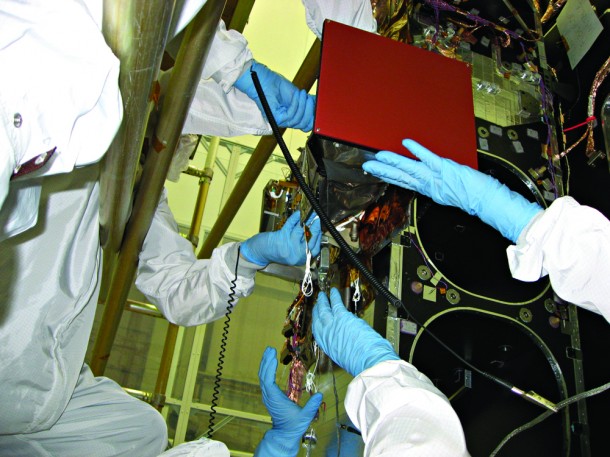 With support from LRO's suite of instruments, LAMP (shown here during installation) has previously determined that hydrogen, mercury and other volatile substances are present in the permanently shaded regions (PSRs) of the moon. It has also observed PSRs are darker at far-ultraviolet wavelengths and redder than nearby surfaces that receive sunlight. These darker regions indicate "fluffy" soils, while the reddening is consistent with the presence of water frost. (Credit: NASA) With support from LRO's suite of instruments, LAMP (shown here during installation) has previously determined that hydrogen, mercury and other volatile substances are present in the permanently shaded regions (PSRs) of the moon. It has also observed PSRs are darker at far-ultraviolet wavelengths and redder than nearby surfaces that receive sunlight. These darker regions indicate "fluffy" soils, while the reddening is consistent with the presence of water frost. (Credit: NASA)
