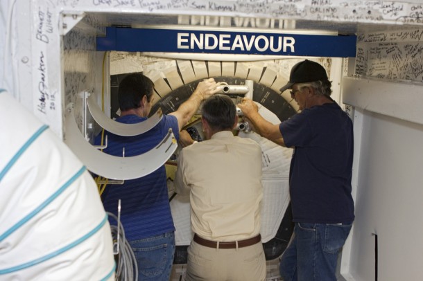 Kennedy Space Center Director Bob Cabana, center, uses a "T"-shaped tool to lock the space shuttle Endeavour's hatch as United Space Alliance technicians Gary Hamilton, left, and Joe Walsh assist. Photo credit: NASA/ Jim Grossmann Kennedy Space Center Director Bob Cabana, center, uses a "T"-shaped tool to lock the space shuttle Endeavour's hatch as United Space Alliance technicians Gary Hamilton, left, and Joe Walsh assist. Photo credit: NASA/ Jim Grossmann