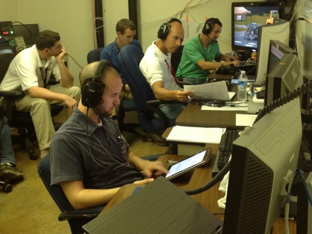 Engineers on the "Mighty Eagle" project evaluate flight data after the successful 100-foot test of the vehicle Aug. 28. In the back, from left, are Adam Lacock, flight manager, and Logan Kennedy, lead systems engineer. From left at the table are Josh Eliser, flight software engineer; Dan Gunter, flight operations engineer; and Jake Parton, test conductor on the flight. (NASA/MSFC) Engineers on the "Mighty Eagle" project evaluate flight data after the successful 100-foot test of the vehicle Aug. 28. In the back, from left, are Adam Lacock, flight manager, and Logan Kennedy, lead systems engineer. From left at the table are Josh Eliser, flight software engineer; Dan Gunter, flight operations engineer; and Jake Parton, test conductor on the flight. (NASA/MSFC)