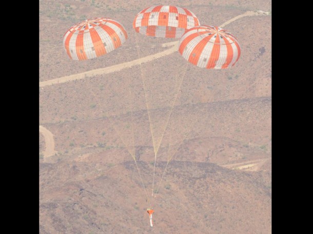 A dart-shaped test vehicle that is used to simulate Orion’s parachute compartment descends above the skies of the U.S. Yuma Army Proving Ground in Arizona. Engineers were testing the maximum pressure Orion’s chutes might face when returning from exploration missions. Photo credit: NASA A dart-shaped test vehicle that is used to simulate Orion’s parachute compartment descends above the skies of the U.S. Yuma Army Proving Ground in Arizona. Engineers were testing the maximum pressure Orion’s chutes might face when returning from exploration missions. Photo credit: NASA