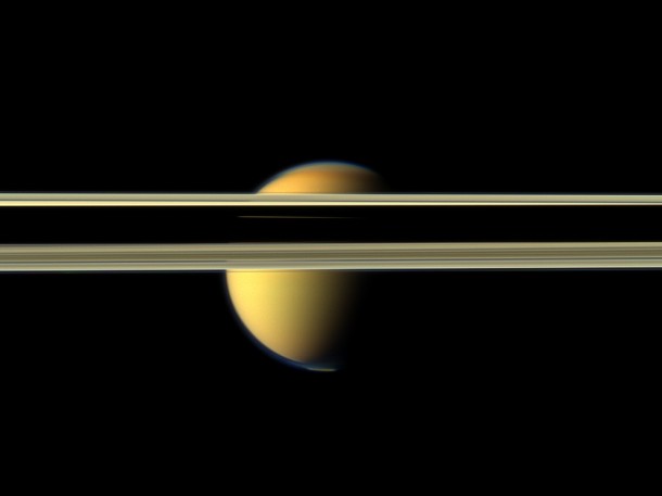 Saturn's rings obscure part of Titan's colorful visage in this image from NASA's Cassini spacecraft. Image Credit: NASA/JPL-Caltech/SSI Saturn's rings obscure part of Titan's colorful visage in this image from NASA's Cassini spacecraft. Image Credit: NASA/JPL-Caltech/SSI