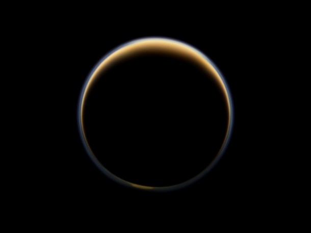 NASA's Cassini spacecraft looks toward the night side of Saturn's largest moon and sees sunlight scattering through the periphery of Titan's atmosphere and forming a ring of color. Image Credit: NASA/JPL-Caltech/SSI NASA's Cassini spacecraft looks toward the night side of Saturn's largest moon and sees sunlight scattering through the periphery of Titan's atmosphere and forming a ring of color. Image Credit: NASA/JPL-Caltech/SSI