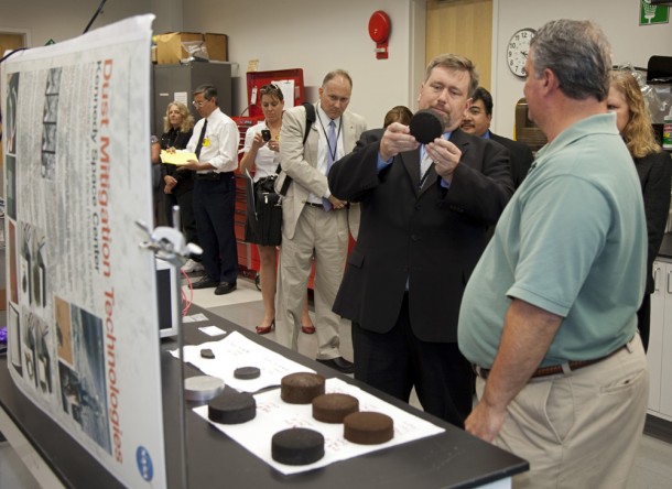 Michael Hogue, right, shows to Mason Peck, NASA's chief technologist, an innovative approach to making heat shields from Martian and lunar soil. Photo credit: NASA/Frankie Martin Michael Hogue, right, shows to Mason Peck, NASA's chief technologist, an innovative approach to making heat shields from Martian and lunar soil. Photo credit: NASA/Frankie Martin