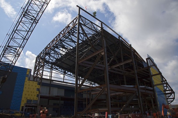 The steel beam after being placed atop the framework for the under-construction exhibit hall for Atlantis. Photo credit: NASA/Kim Shiflett The steel beam after being placed atop the framework for the under-construction exhibit hall for Atlantis. Photo credit: NASA/Kim Shiflett