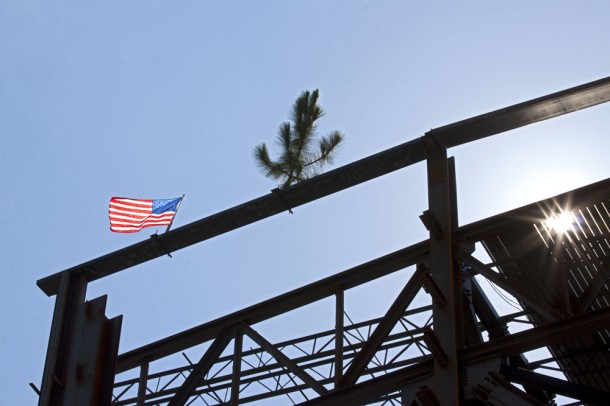 The beam was placed with a small tree and an American flag bolted to it to mark the topping out. Photo credit: Kim Shiflett The beam was placed with a small tree and an American flag bolted to it to mark the topping out. Photo credit: Kim Shiflett
